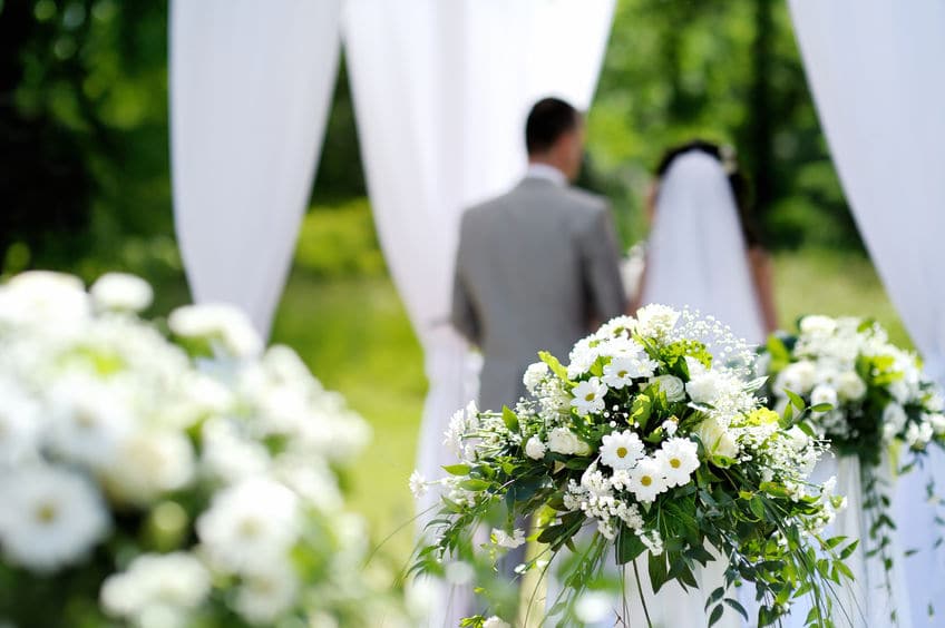 40753857 white flowers decorations during outdoor wedding ceremony